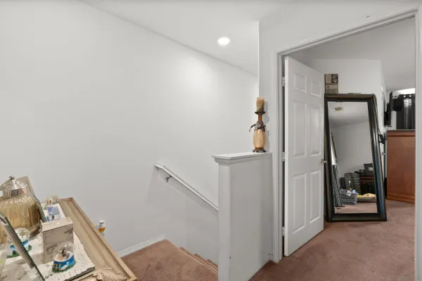 a view of a hallway with workspace and entryway