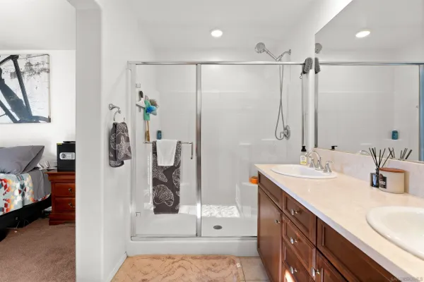 a bathroom with a double vanity sink and a mirror