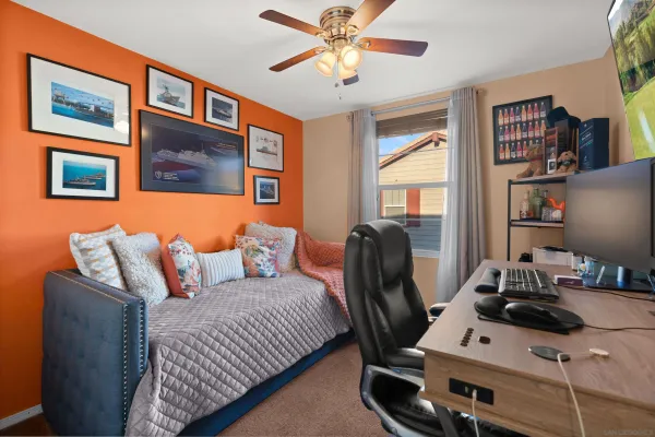 a bedroom with furniture and a window