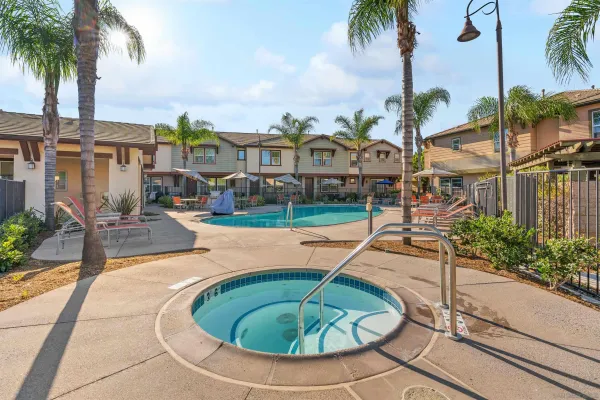 a swimming pool with outdoor seating and yard