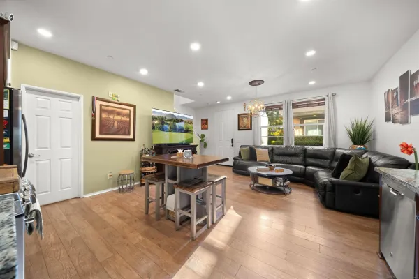 a living room with furniture window and wooden floor