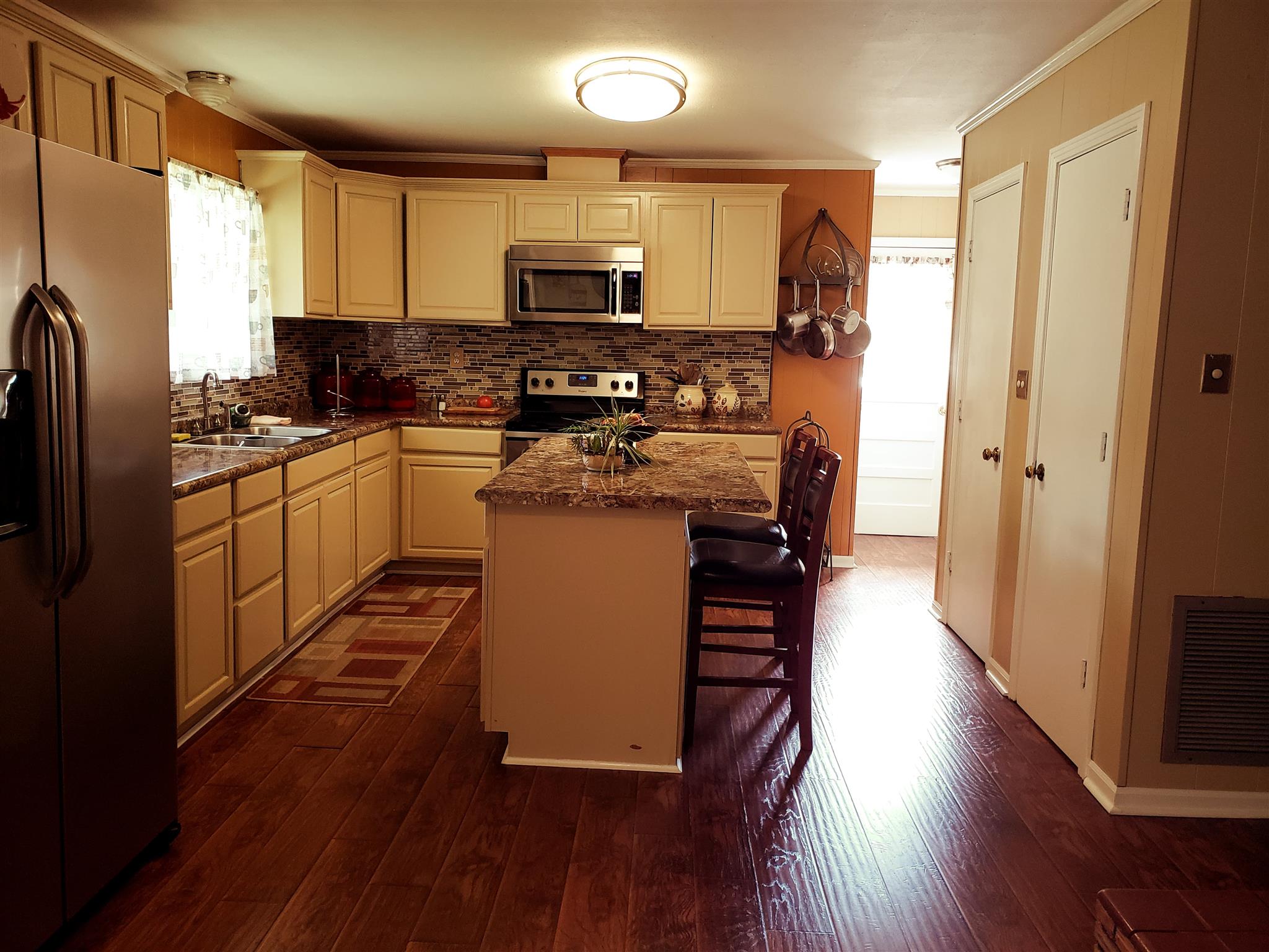 Huge kitchen with wood burning fireplace as well. Lots of cabinets.