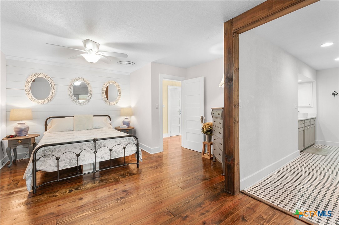 951 Moseley Road Copperas Cove, TX 76522 - Photo 13 of 43 a bedroom with a bed and a chandelier