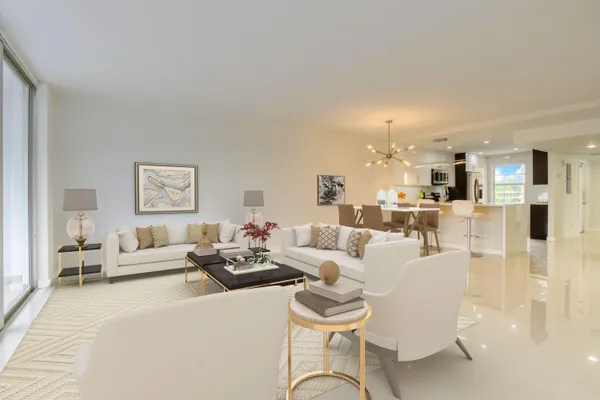 a living room with furniture white walls and white walls
