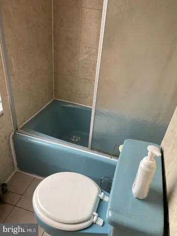 a bathroom with a toilet and a sink