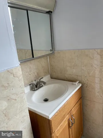 a bathroom with a sink and mirror