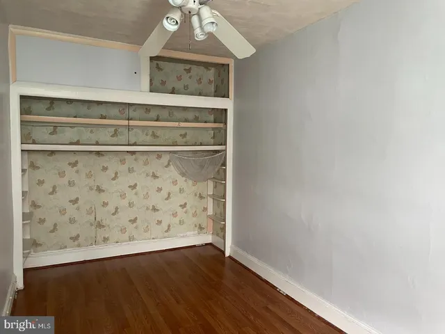 a view of wooden floor with chandelier
