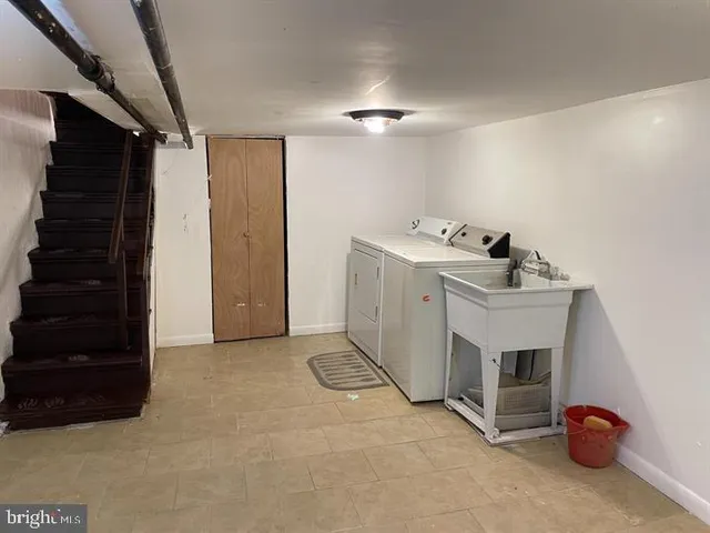 a view of storage and utility room with closet