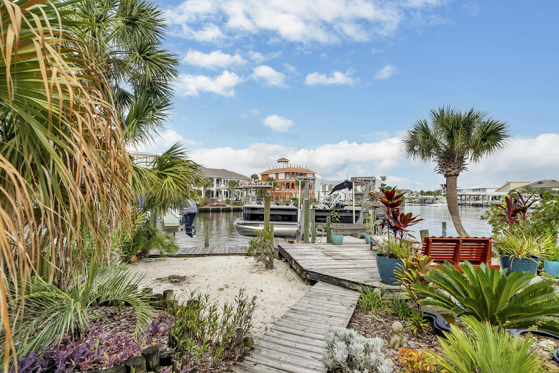 173 Durango Road Destin, FL 32541 - Photo 16 of 37 a view of a yard with plants and palm trees
