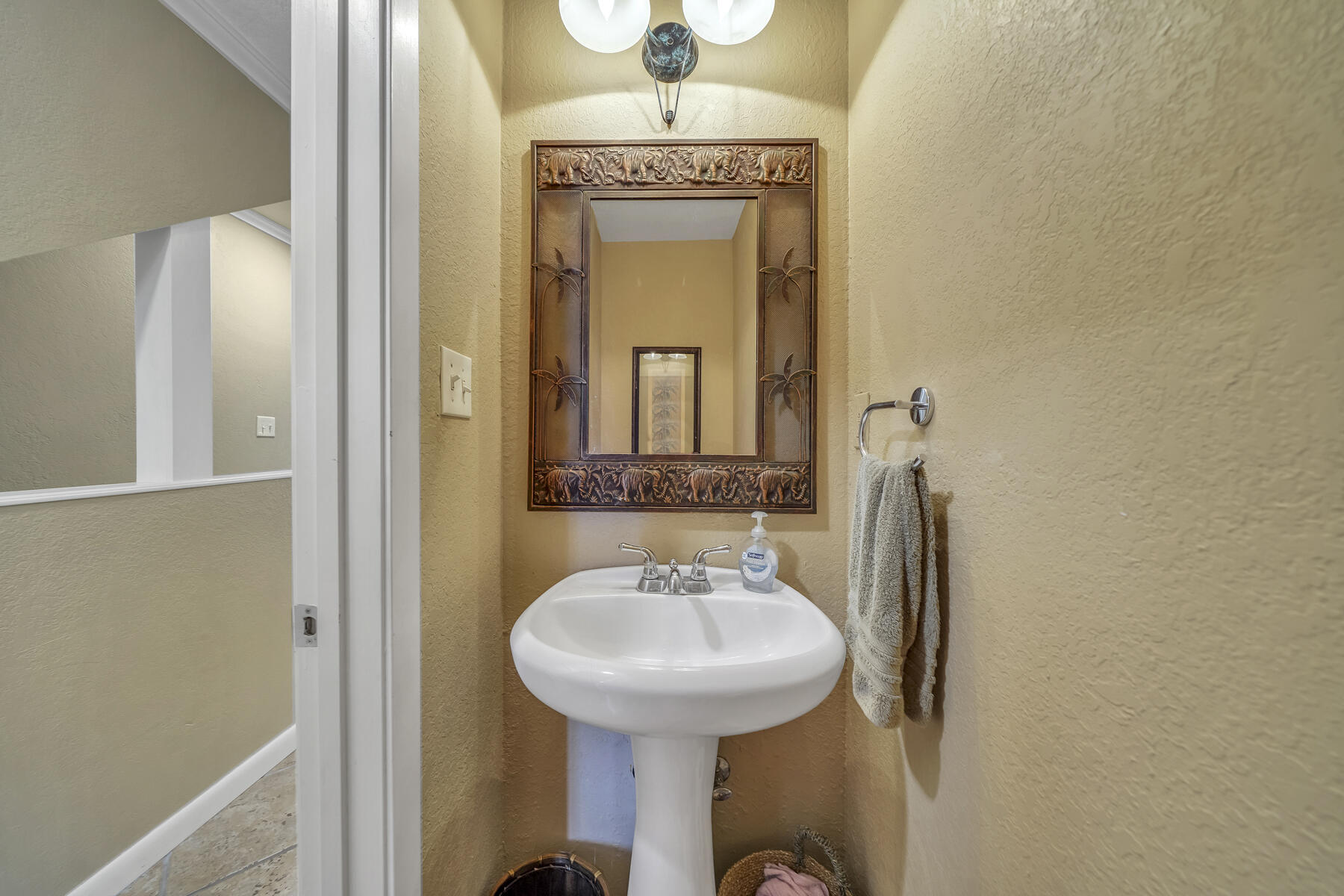 173 Durango Road Destin, FL 32541 - Photo 20 of 37 a bathroom with a sink and a mirror