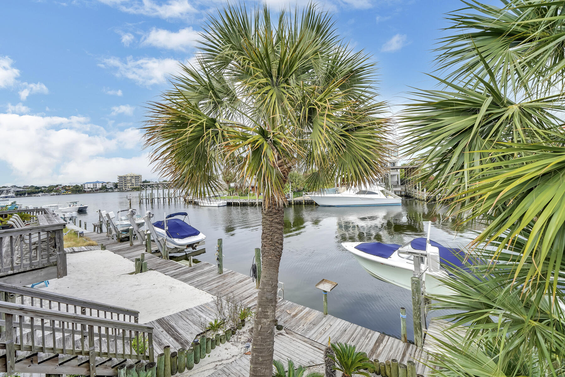 173 Durango Road Destin, FL 32541 - Photo 3 of 37 a view of a roof deck with couches and wooden floor