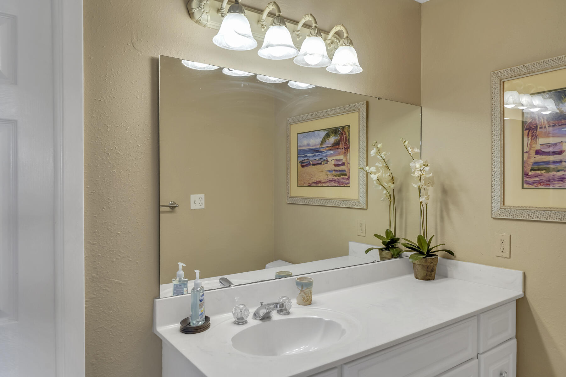 173 Durango Road Destin, FL 32541 - Photo 33 of 37 a bathroom with a sink a large mirror and a shower