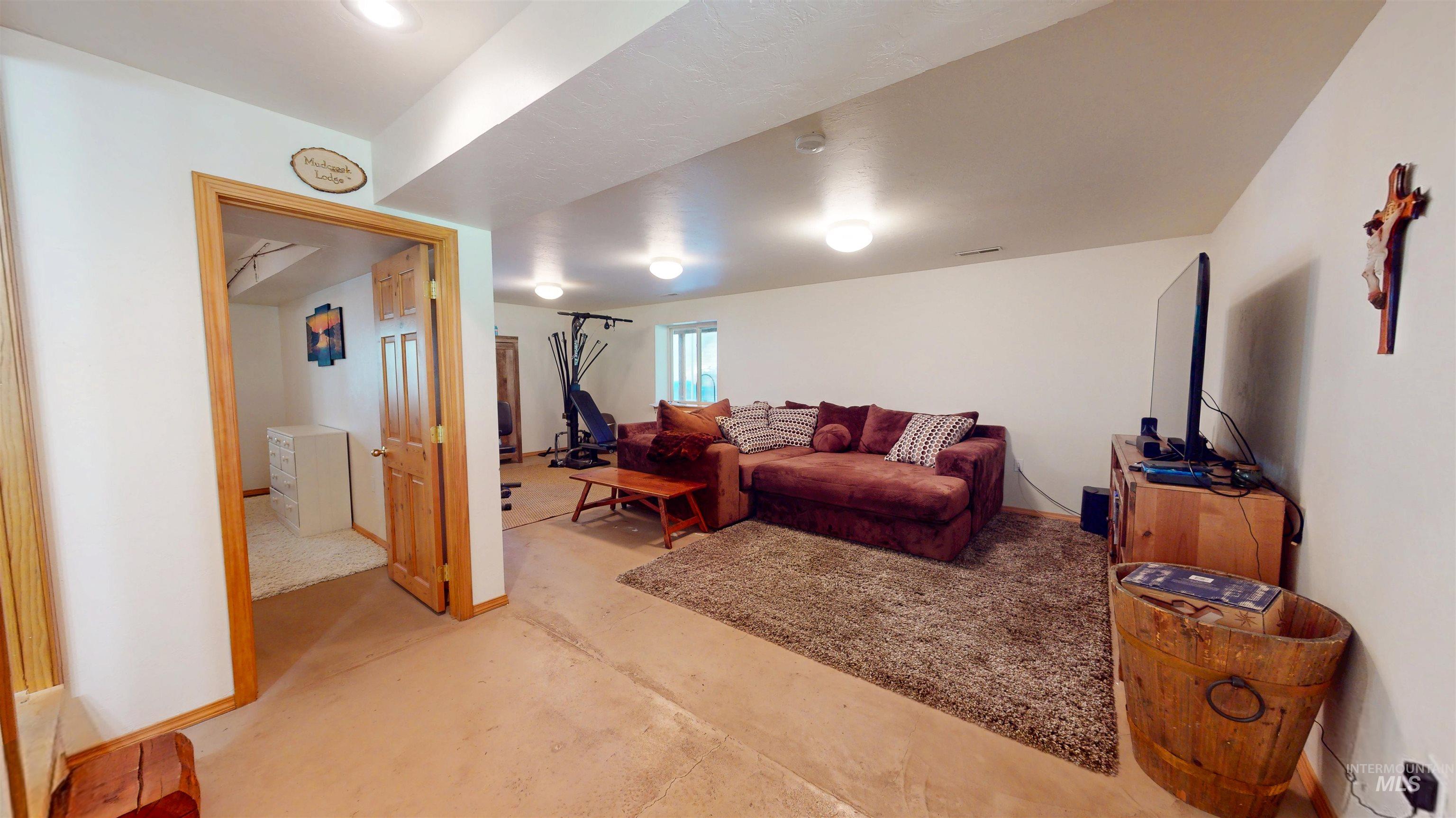 1314 River Road Buhl, ID 83316 - Photo 27 of 45 Living room featuring concrete flooring and baseboards