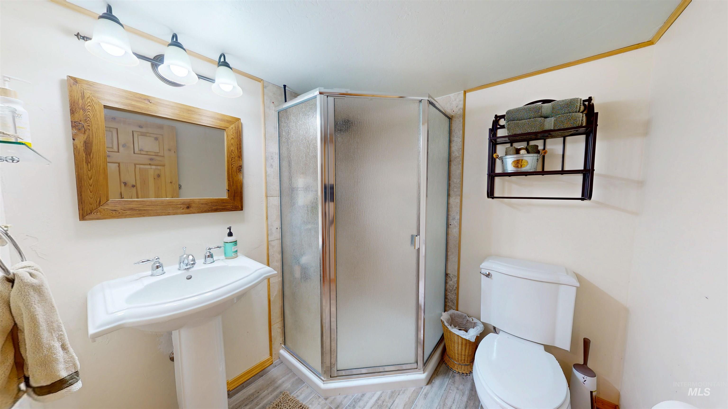 1314 River Road Buhl, ID 83316 - Photo 31 of 45 Full bath featuring a stall shower and wood finished floors