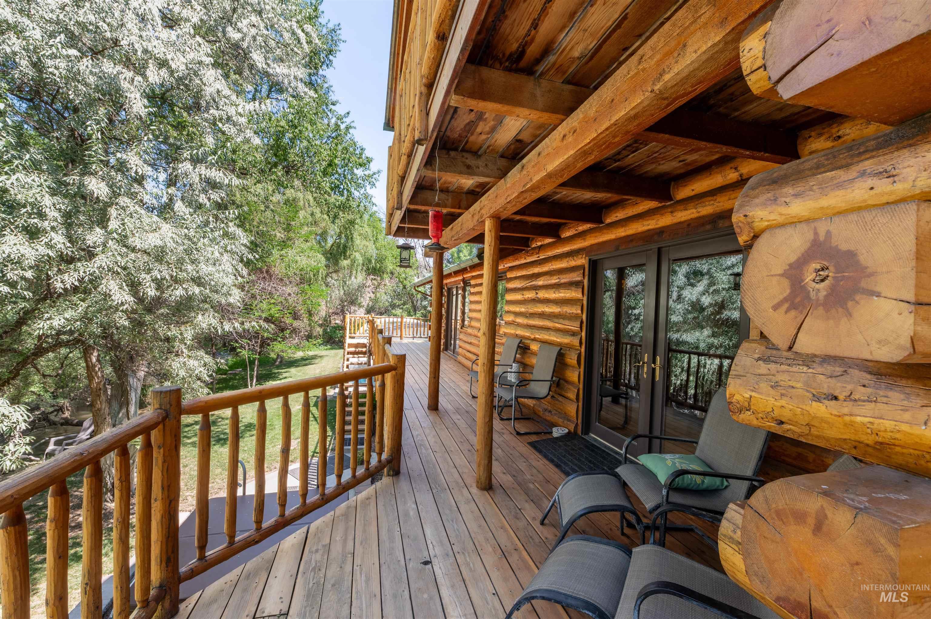 1314 River Road Buhl, ID 83316 - Photo 40 of 45 Wooden terrace featuring french doors and view of scattered trees