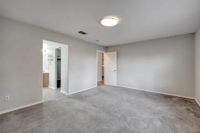 a bathroom with a sink toilet vanity and shower