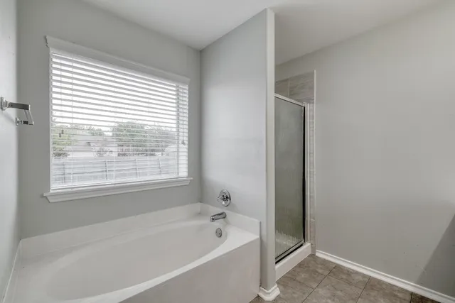 a bathroom with a sink a toilet and a large mirror