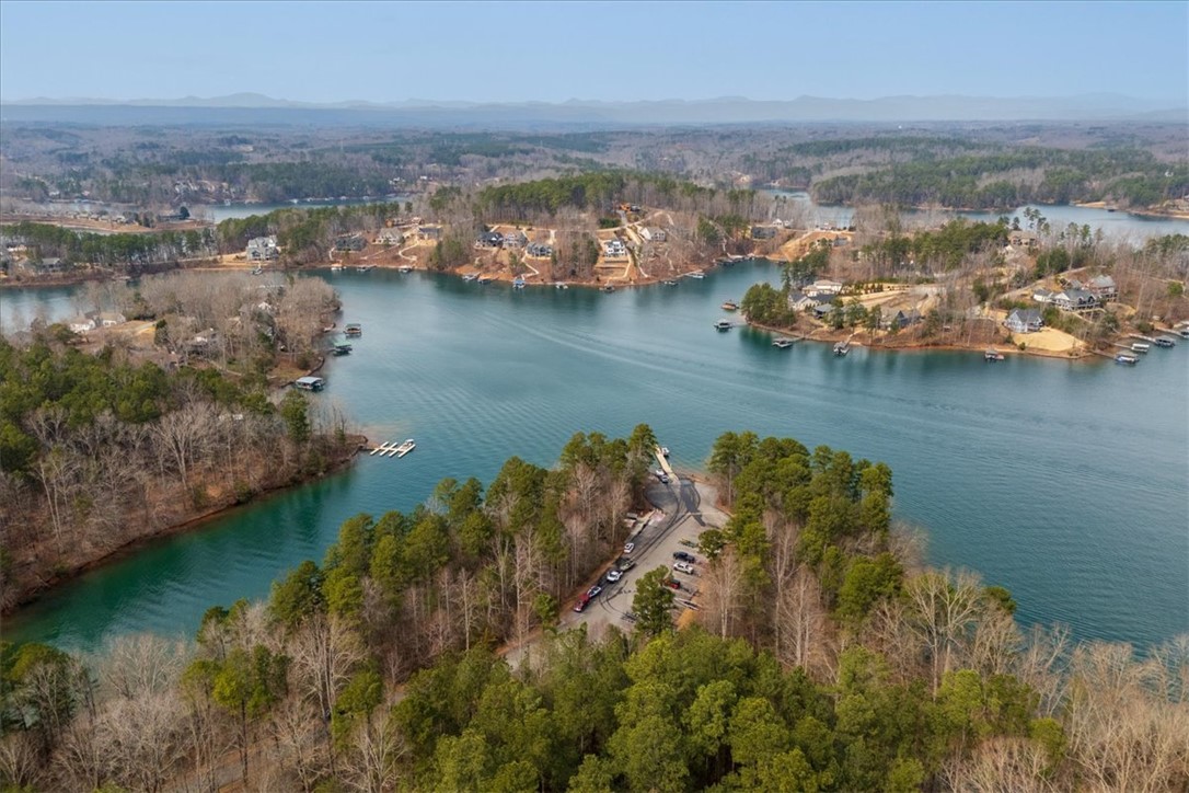 38 Angus Run Seneca, SC 29672 - Photo 45 of 46 Aerial view showcasing serene lakefront properties and a convenient boat ramp.