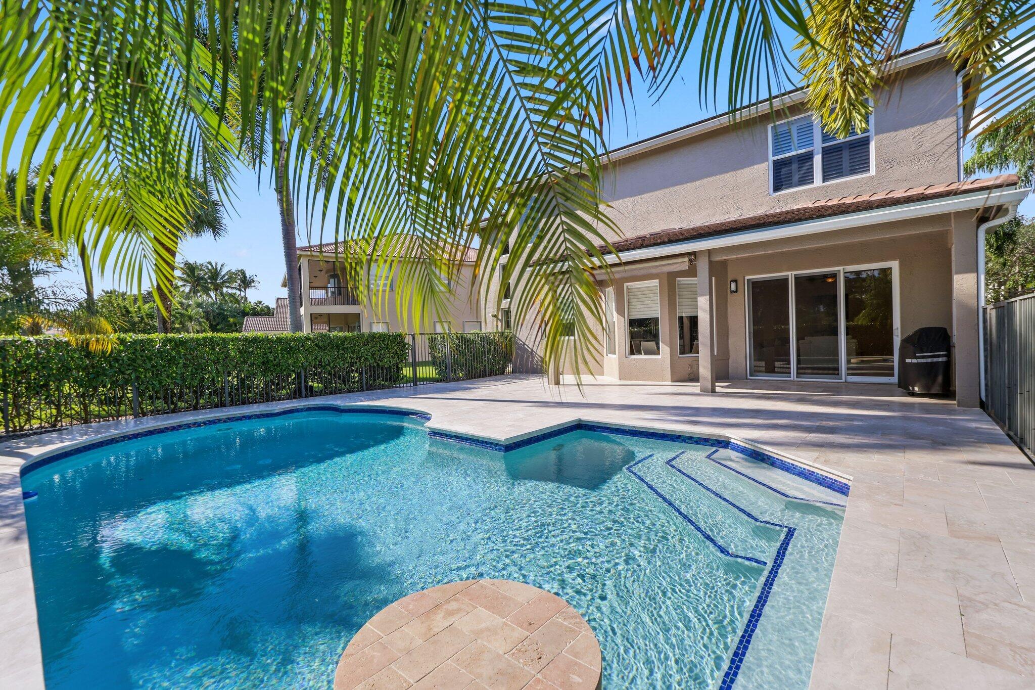 19245 Skyridge Circle Boca Raton, FL 33498 - Photo 37 of 70 a view of a house with swimming pool and a small yard