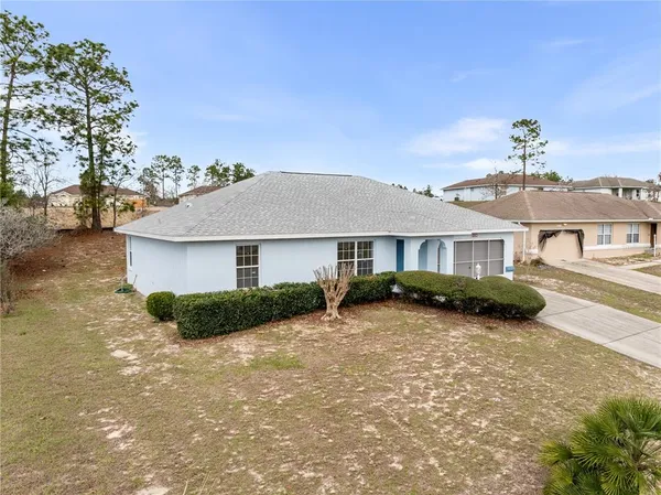 a front view of a house with yard