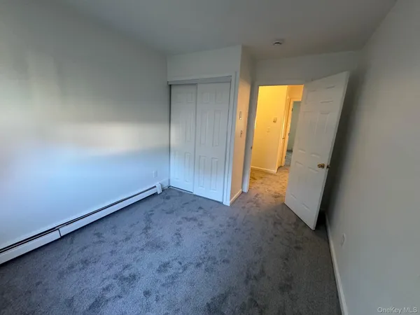 a view of field with tall trees