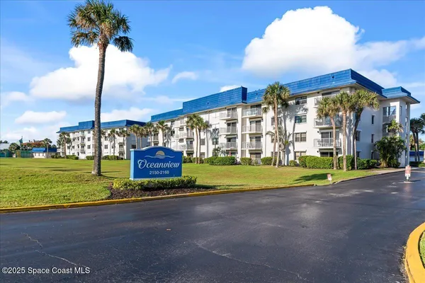 a view of a building with a yard