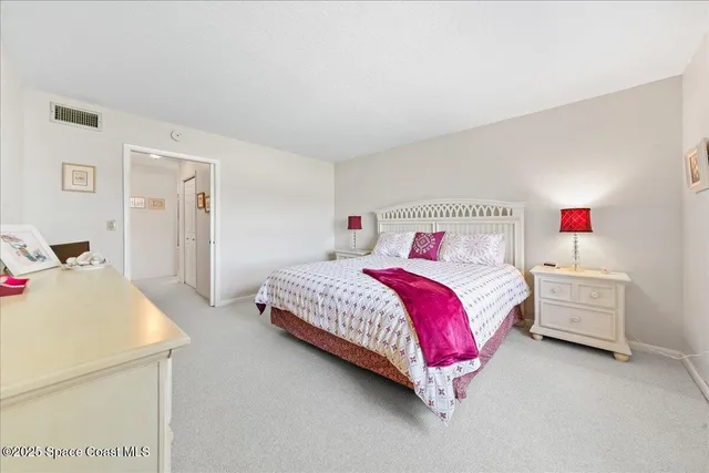 a bedroom with a bed and a closet