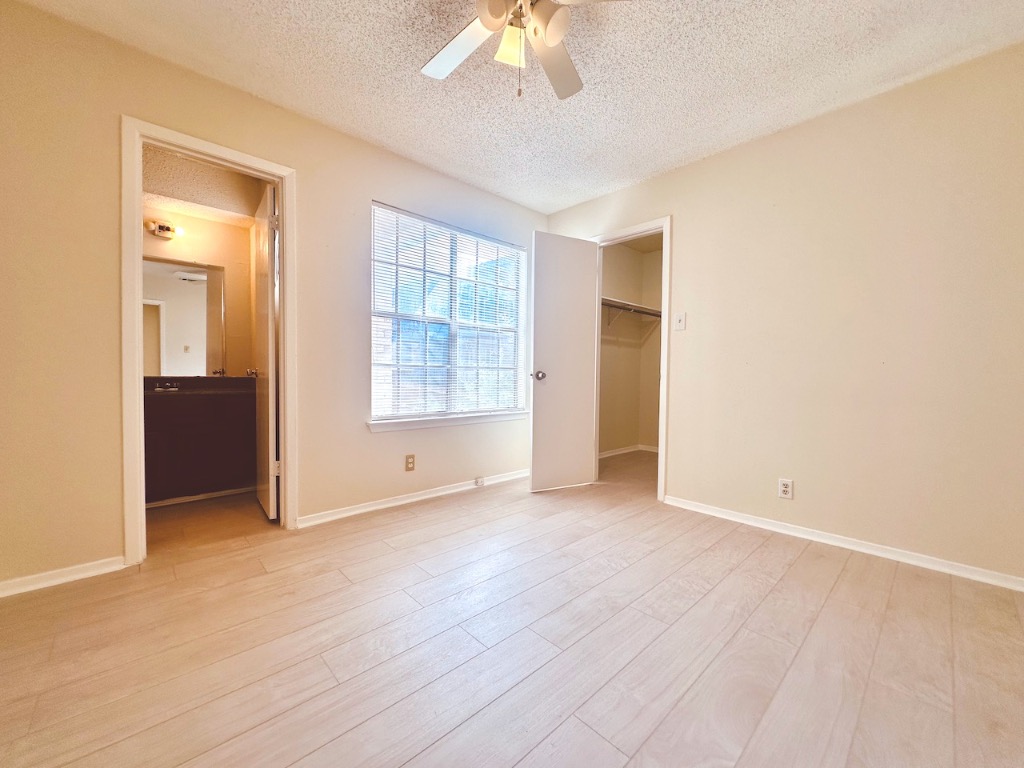 2004 Kirksey Drive, Unit D Austin, TX 78741 - Photo 14 of 20 a view of an empty room with a window