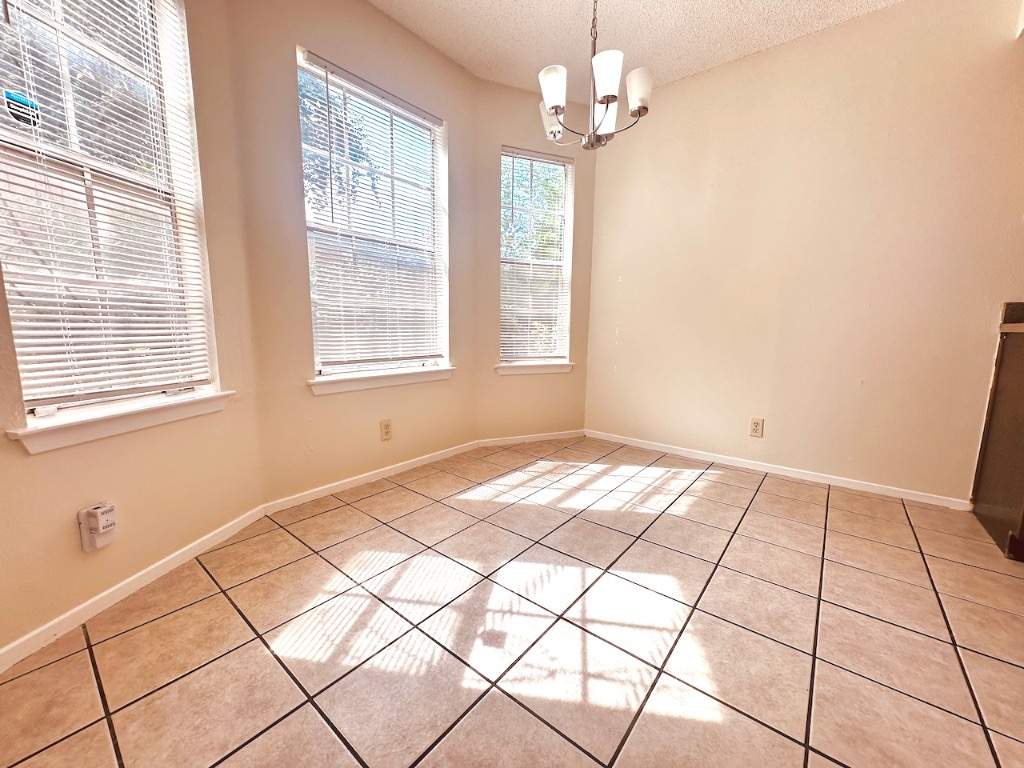 2004 Kirksey Drive, Unit D Austin, TX 78741 - Photo 3 of 20 a view of an empty room and window