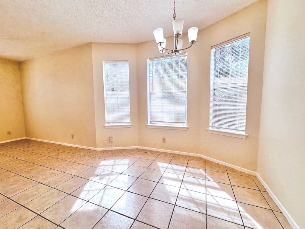 2004 Kirksey Drive, Unit D Austin, TX 78741 - Photo 4 of 20 a view of an empty room with a window