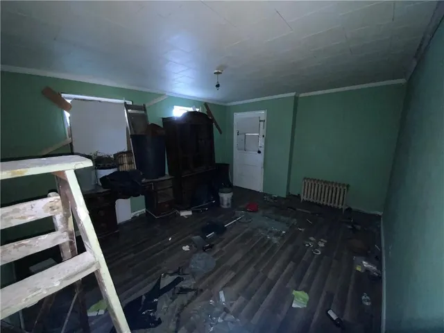 a view of a livingroom with furniture and wooden floor