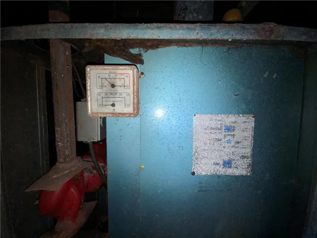 a bathroom with a granite countertop shower a stove and a sink