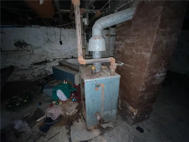 a view of a backyard with table and chairs