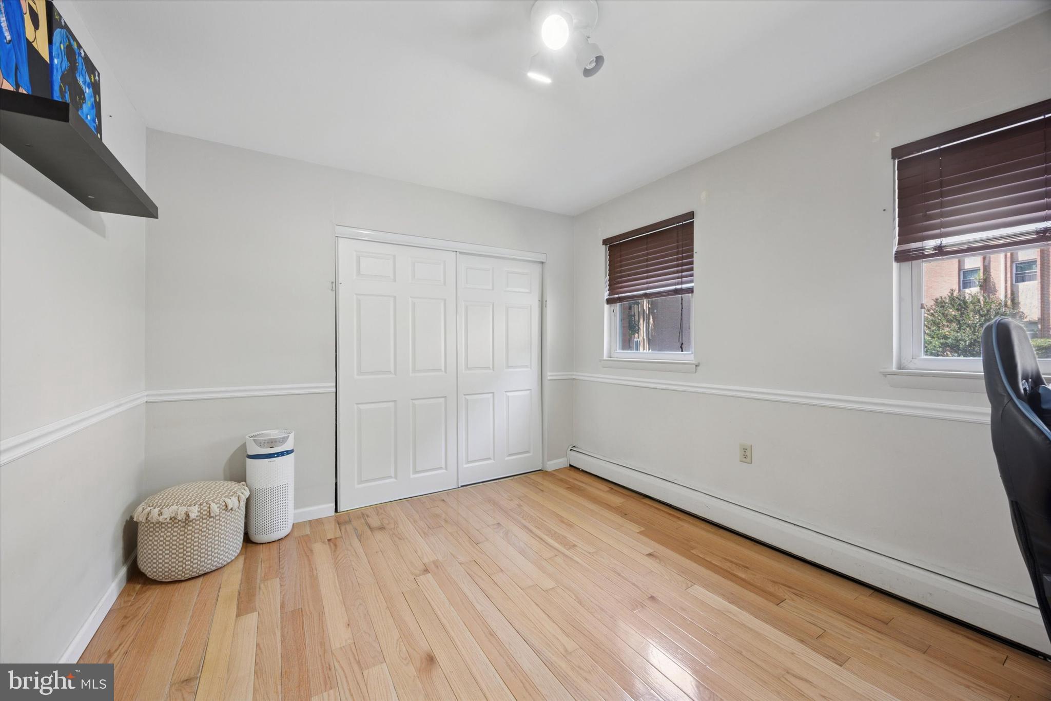 302 River Road, Unit D8 Wilmington, DE 19809 - Photo 15 of 20 a view of empty room with wooden floor and fan