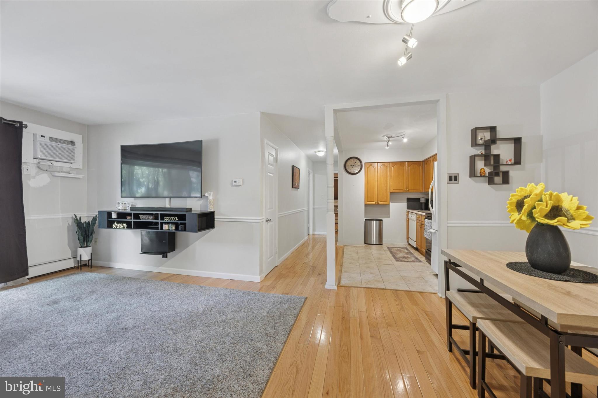 302 River Road, Unit D8 Wilmington, DE 19809 - Photo 4 of 20 a view of a kitchen with kitchen island a counter top space a sink and stainless steel appliances