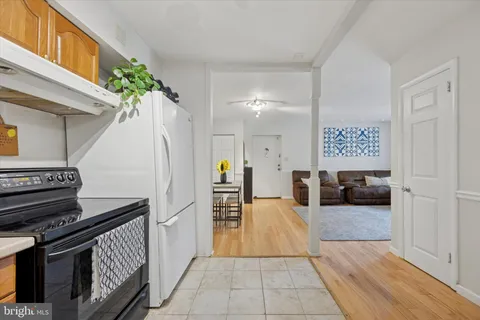 a view of a hallway with entryway and furniture