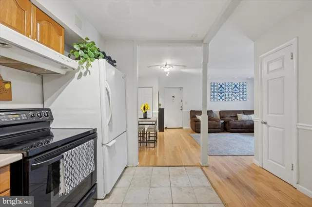 a view of a hallway with entryway and furniture