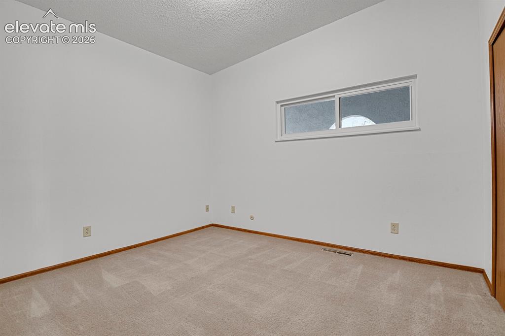 1122 Fontmore Road, Unit C Colorado Springs, CO 80904 - Photo 25 of 33 Large third bedroom for guestsThird