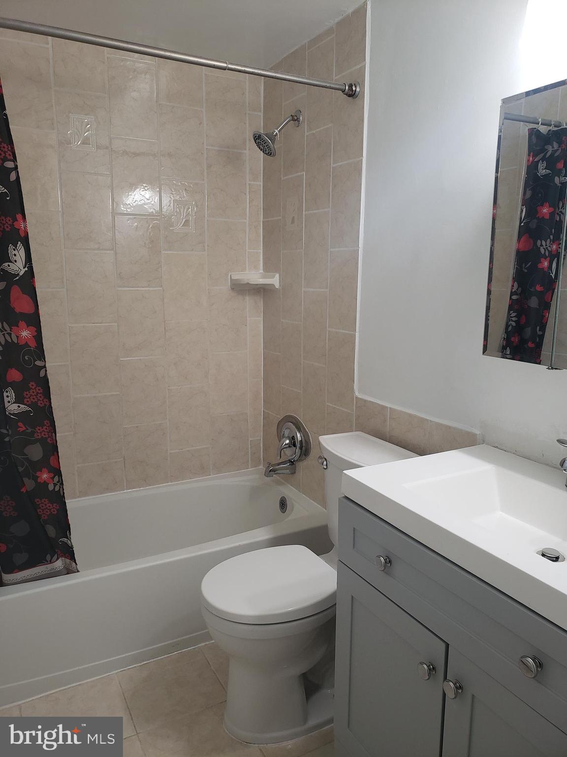 13350 Kerrydale Road Woodbridge, VA 22193 - Photo 6 of 10 a bathroom with a sink a toilet and shower