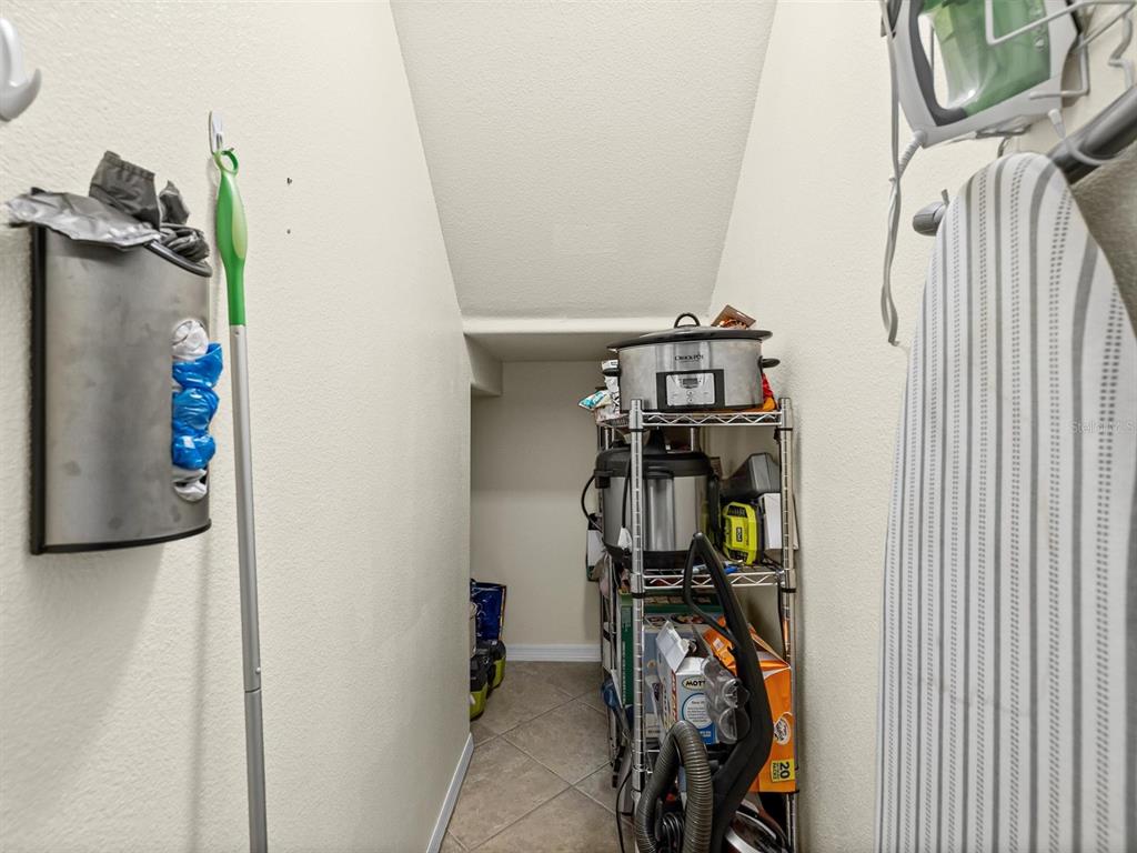 9588 Trumpet Vine Loop Trinity, FL 34655 - Photo 12 of 49 a view of walk in closet with clothes and shoes