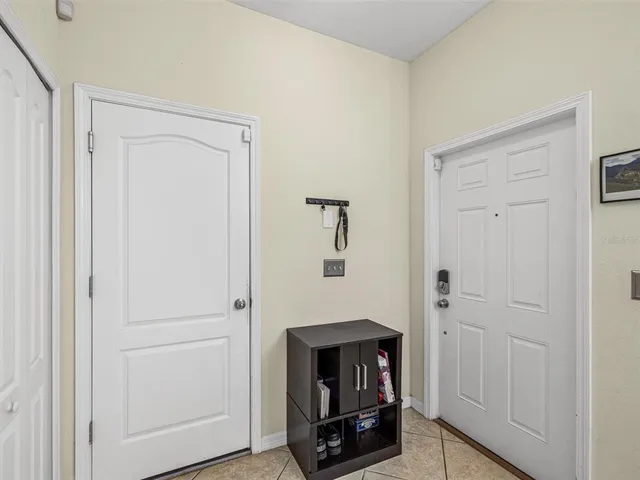 a room with a fireplace and mirror