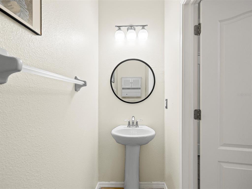 9588 Trumpet Vine Loop Trinity, FL 34655 - Photo 15 of 49 a bathroom with a sink and a mirror