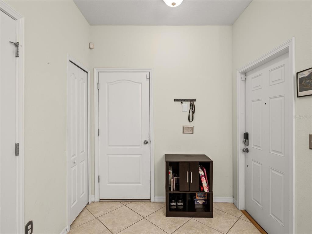 9588 Trumpet Vine Loop Trinity, FL 34655 - Photo 16 of 49 a view of an entryway with table and door