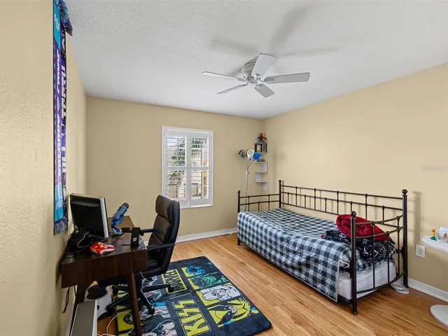 a bedroom with furniture and a window