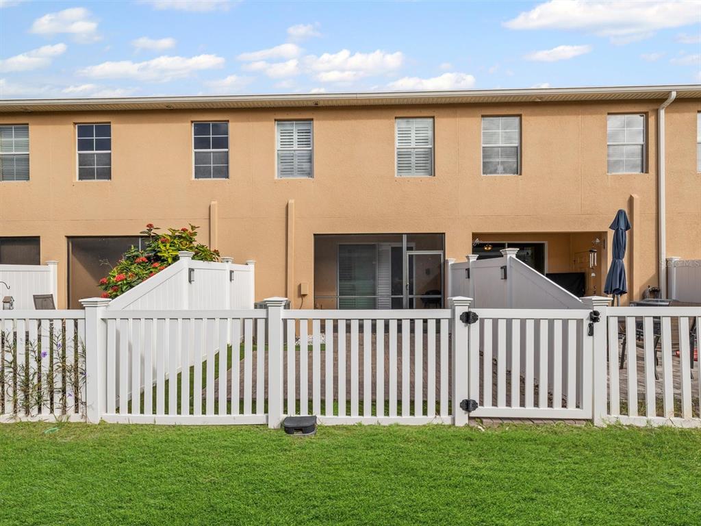 9588 Trumpet Vine Loop Trinity, FL 34655 - Photo 35 of 49 a front view of a house with a garden