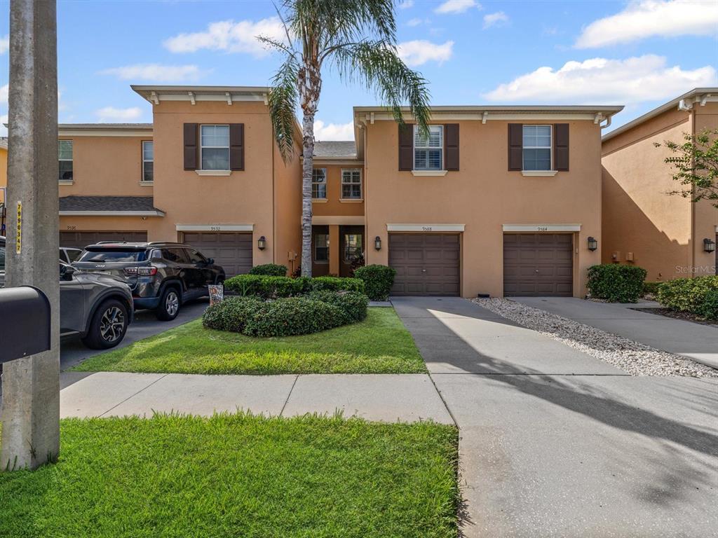 9588 Trumpet Vine Loop Trinity, FL 34655 - Photo 40 of 49 a view of a house with a yard and a street