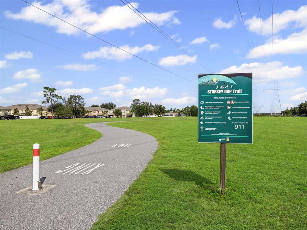 9588 Trumpet Vine Loop Trinity, FL 34655 - Photo 47 of 49 a view of a golf course with a garden