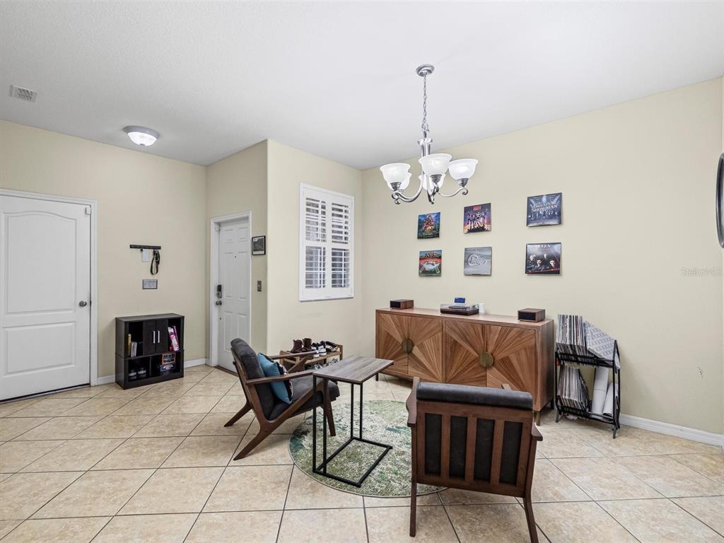 9588 Trumpet Vine Loop Trinity, FL 34655 - Photo 5 of 49 a living room with furniture and a fireplace