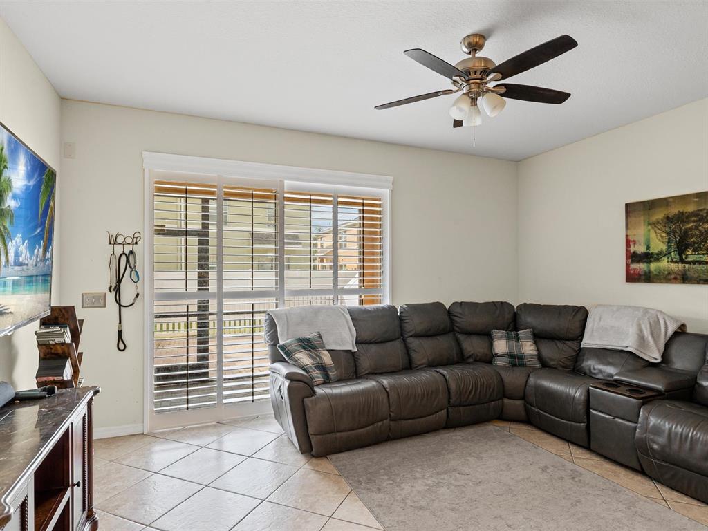 9588 Trumpet Vine Loop Trinity, FL 34655 - Photo 10 of 49 a living room with furniture and a flat screen tv