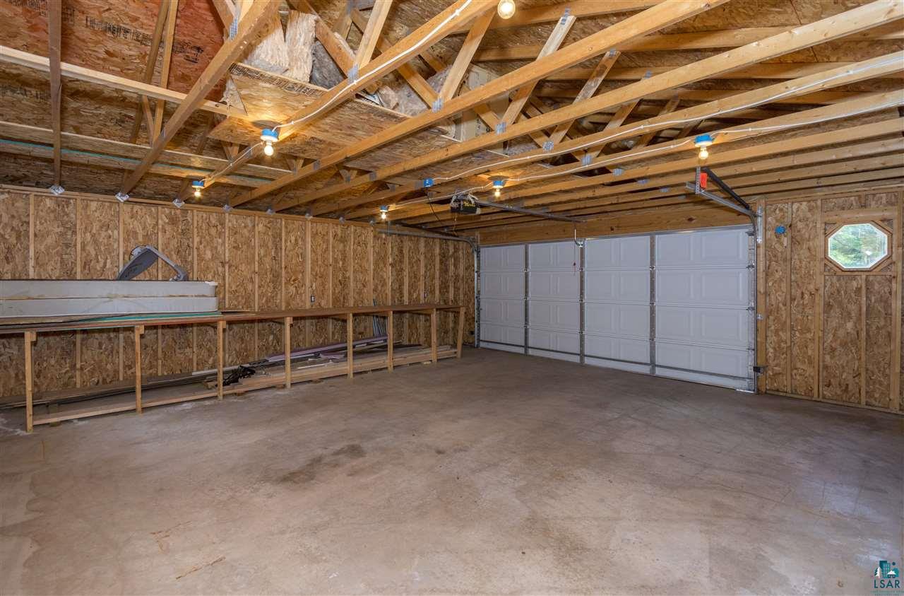 6190 East Lyman Lake Road South Range, WI 54874 - Photo 23 of 25 Inside 2+ stall garage, concrete pad, garage door opener